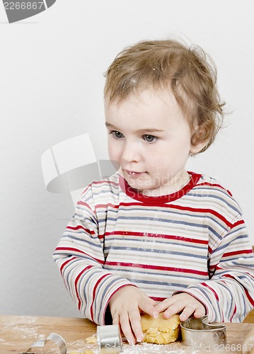 Image of young child making cookies