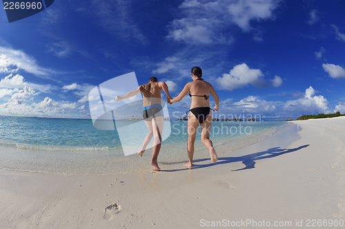Image of happy young couple have fun on summer