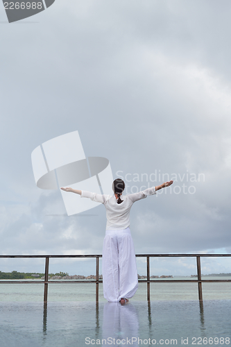 Image of young woman relax on cloudy summer day