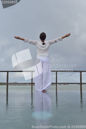 Image of young woman relax on cloudy summer day