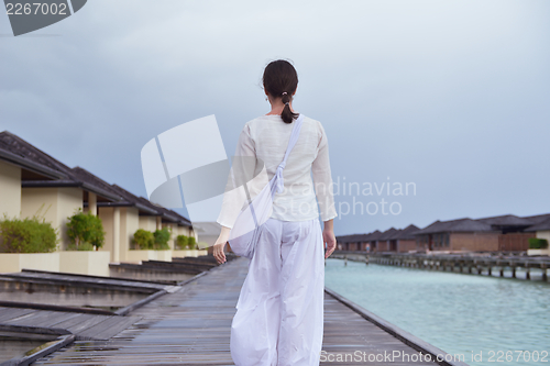 Image of young woman relax on cloudy summer day