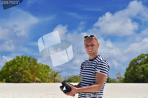 Image of photographer taking photo on beach