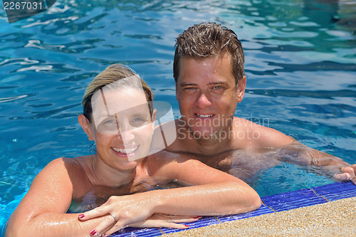 Image of happy young  couple at summer vacation have fun and relax at bea