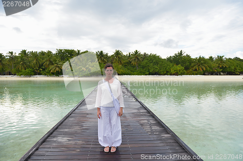 Image of young woman relax on cloudy summer day
