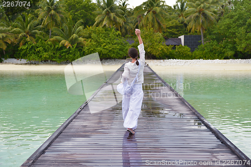Image of young woman relax on cloudy summer day