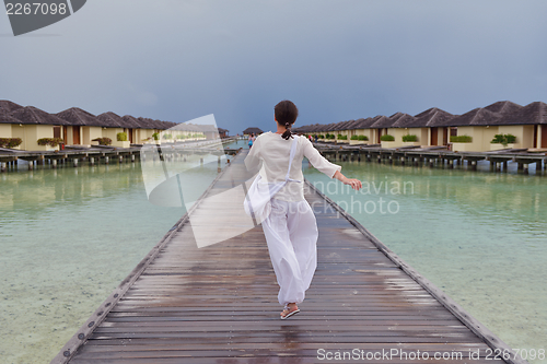 Image of young woman relax on cloudy summer day