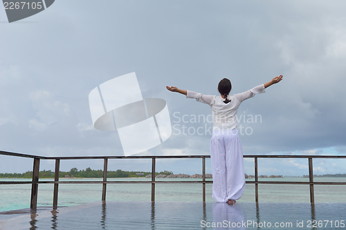 Image of young woman relax on cloudy summer day