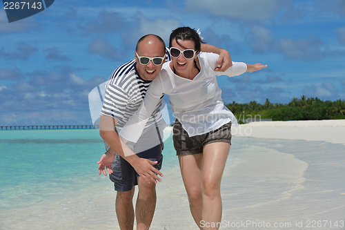 Image of happy young couple have fun on summer