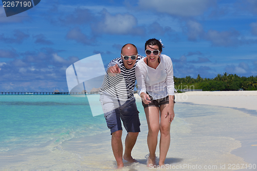 Image of happy young couple have fun on summer