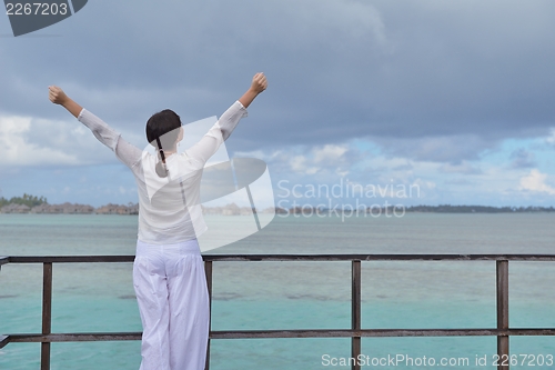 Image of young woman relax on cloudy summer day