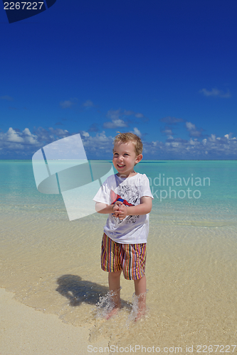 Image of happy young kid on beach