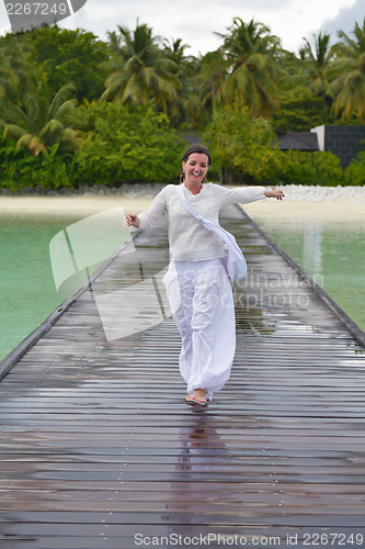 Image of young woman relax on cloudy summer day