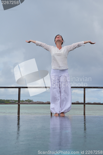 Image of young woman relax on cloudy summer day
