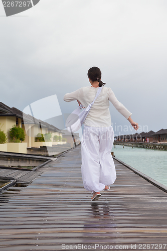 Image of young woman relax on cloudy summer day