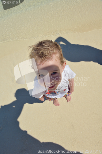 Image of happy young kid on beach