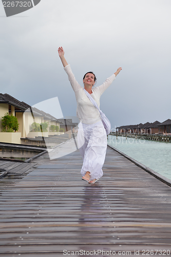 Image of young woman relax on cloudy summer day