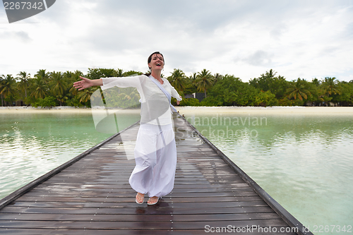 Image of young woman relax on cloudy summer day