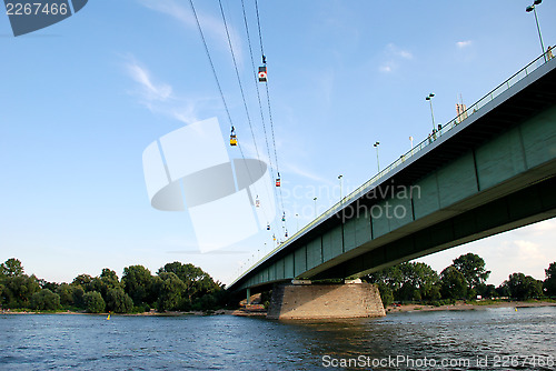 Image of Cable cars cross the Rhine in Cologne, Germany