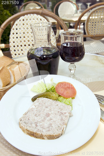 Image of French food pate terrine of rabbit with red wine in cafe photogr