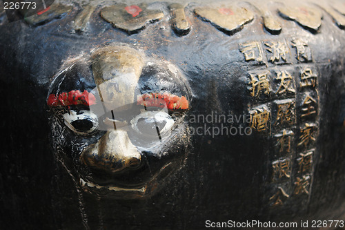 Image of Close-up of a face sculpture at a temple in China