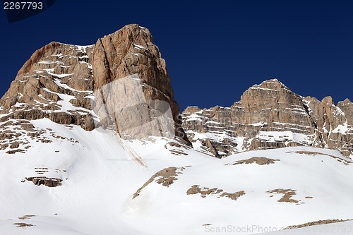 Image of Rocks in snow and clear blue sky