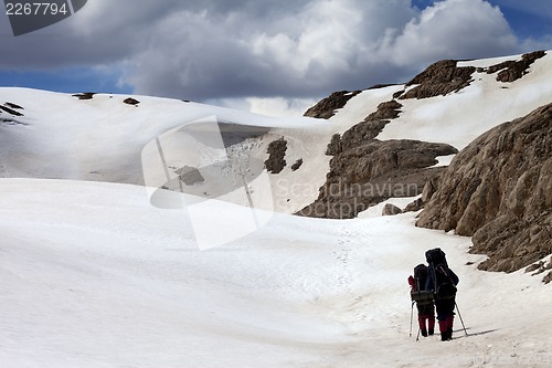 Image of Two hikers on snow plateau