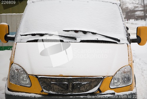 Image of Snow covered car.