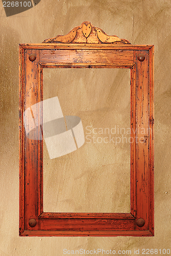 Image of ancient wooden frame on the wall