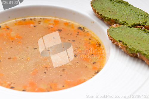 Image of Italian minestrone soup with pesto crostini on side