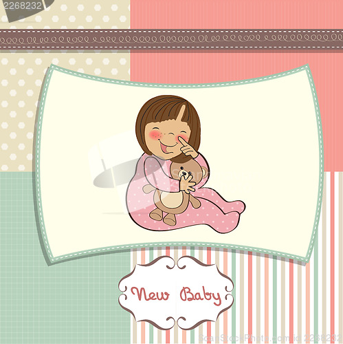 Image of little baby girl with her teddy bear toy