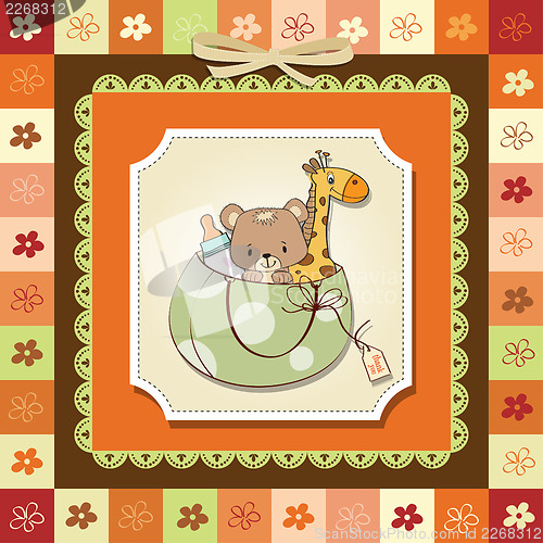 Image of new baby announcement card with bag and same toys