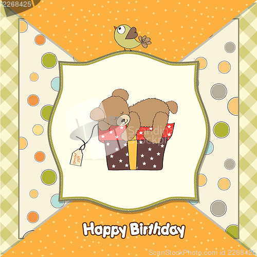 Image of birthday greeting card with teddy bear and big gift box