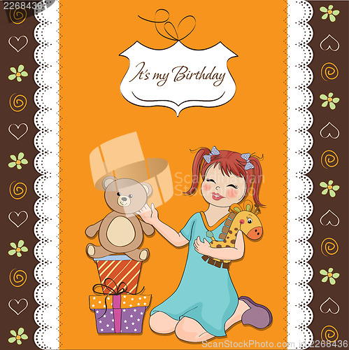 Image of little girl playing with her birthday gifts . happy birthday car