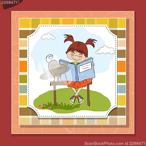 Image of young sweet girl reading a book