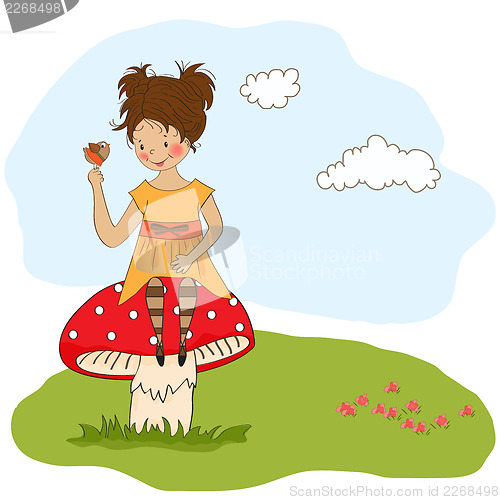 Image of pretty young girl sitting on a mushroom