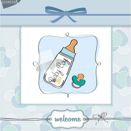 Image of baby announcement card with milk bottle and pacifier