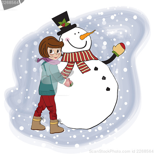 Image of Cute little girl with snowman