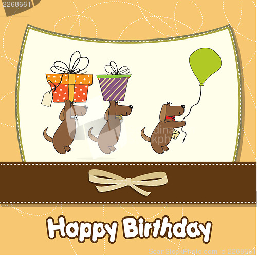 Image of three dogs that offer a big gift. birthday greeting card