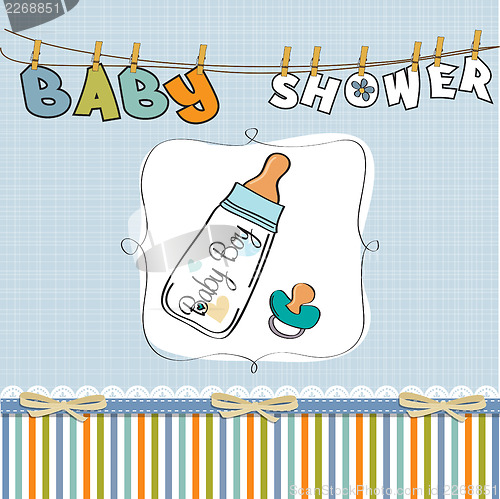 Image of baby announcement card with milk bottle and pacifier