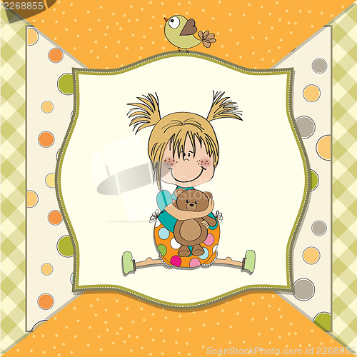 Image of little girl sitting with her teddy bear