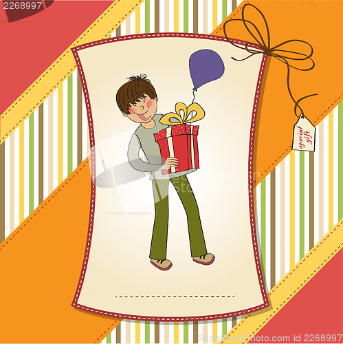Image of birthday card with boy and big gift box