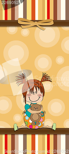 Image of little girl sitting with her teddy bear