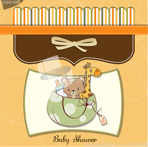 Image of new baby announcement card with bag and same toys