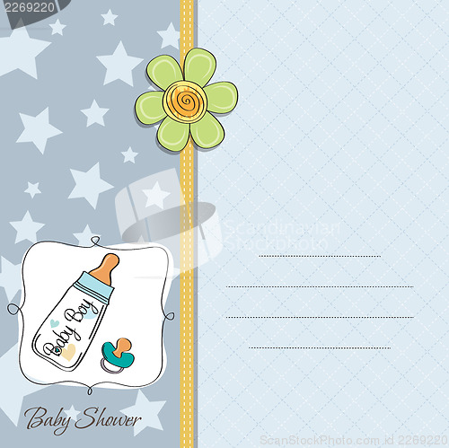 Image of baby announcement card with milk bottle and pacifier