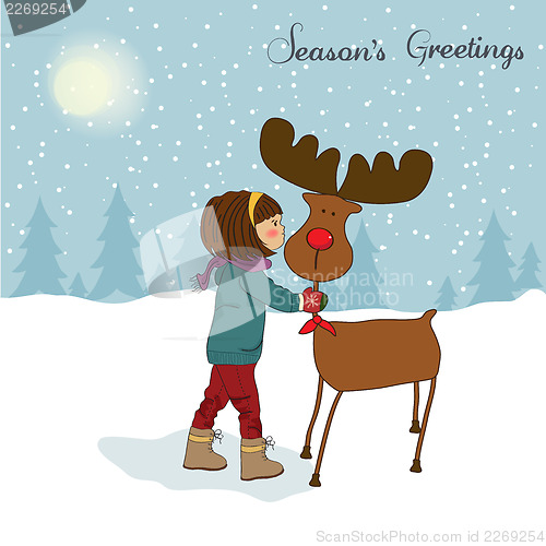 Image of Christmas card with cute little girl caress a reindeer