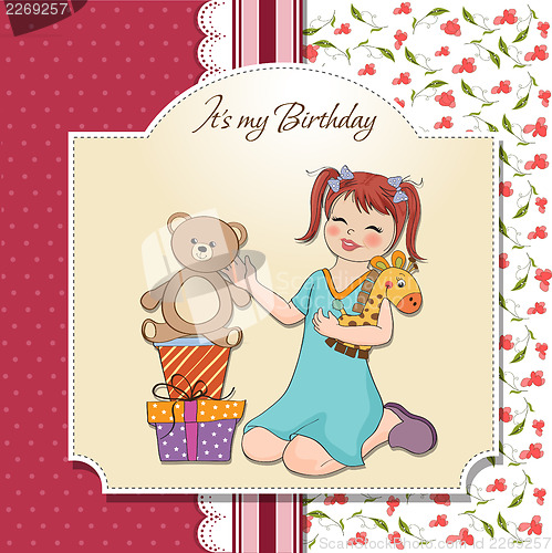 Image of little girl playing with her birthday gifts . happy birthday car