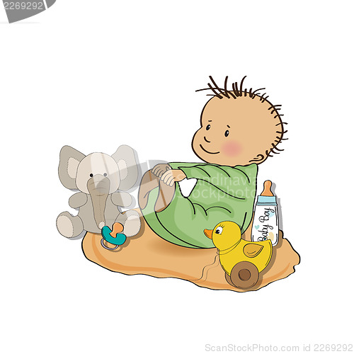 Image of little baby boy play with his toys