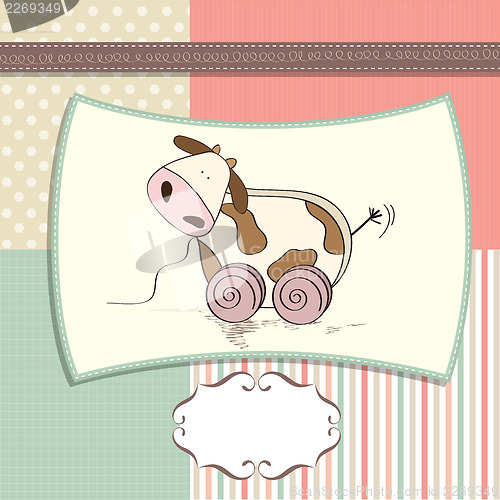 Image of childish card with cute cow toy