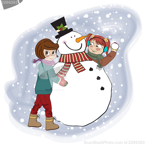 Image of two happy girls building a snowman