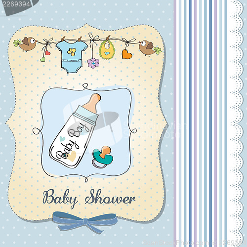 Image of baby announcement card with milk bottle and pacifier